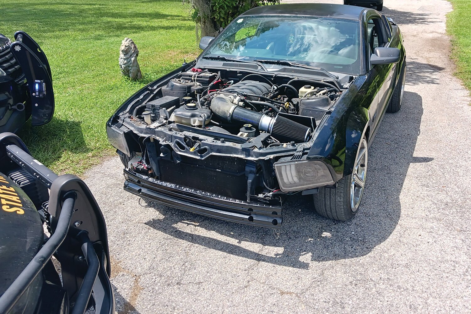 The hood was removed to alter the appearance of the vehicle.